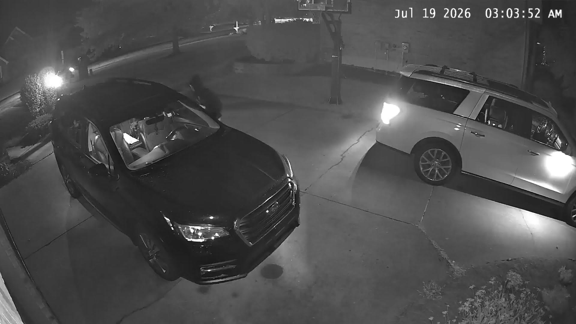 Surveillance video shows a suspect near a vehicle in Goshen Township