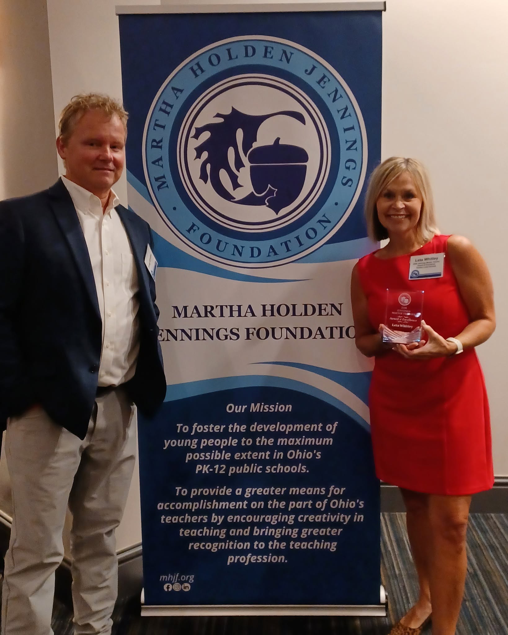 Leta Whitley receives her award from a Martha Holden Jennings Foundation representative