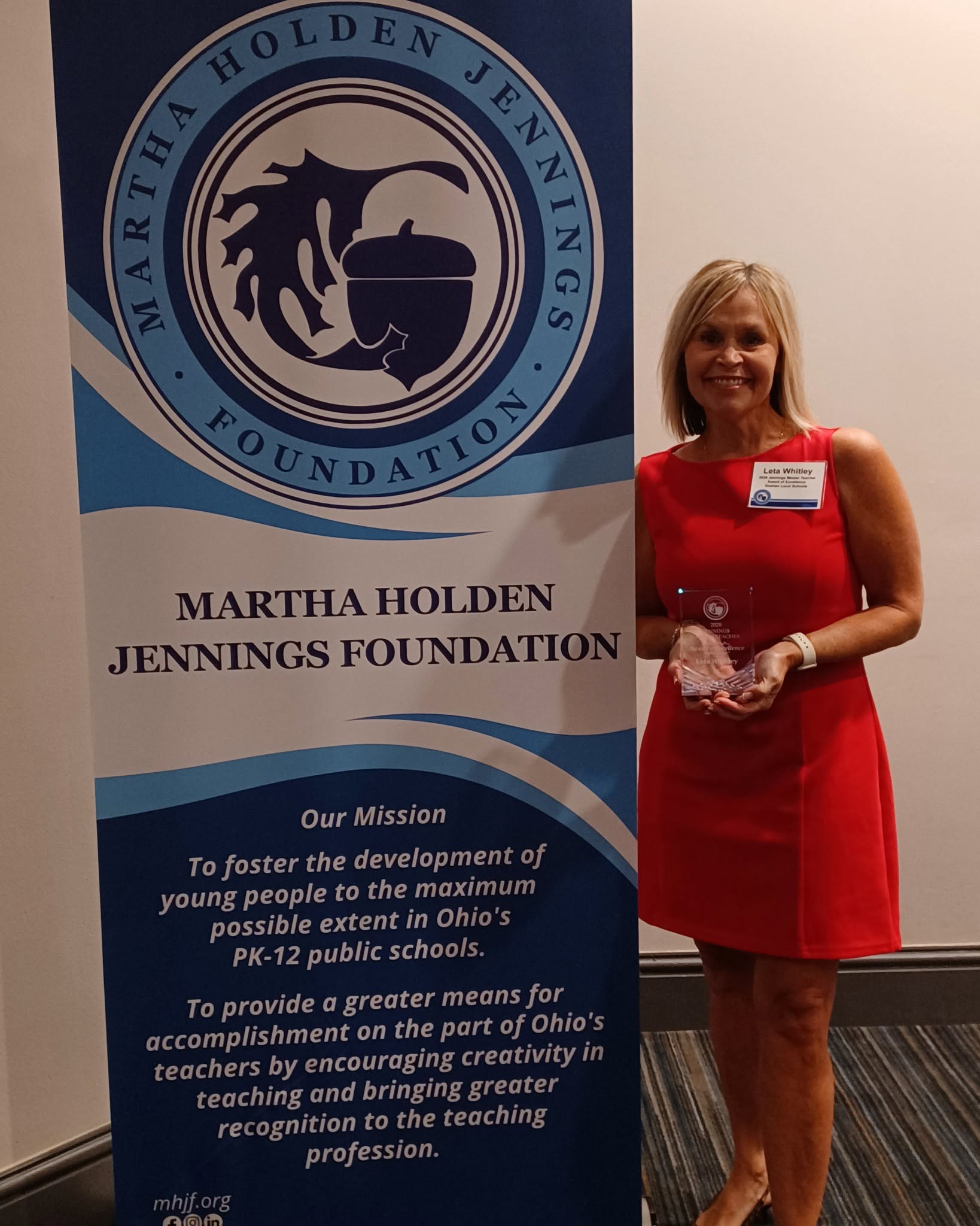 Leta Whitley poses with her Jennings Master Teacher Award of Excellence