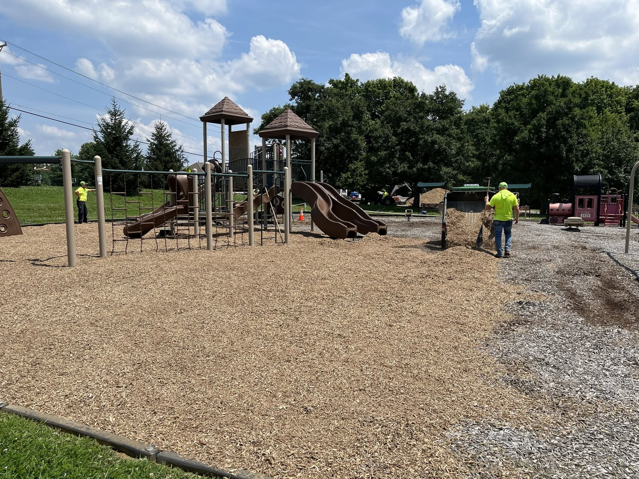 Pierce Township service crews spread fresh mulch at the Locust Corner Park playground
