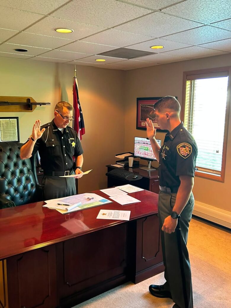 Sheriff Christopher Stratton swears in Deputy Adam Miller
