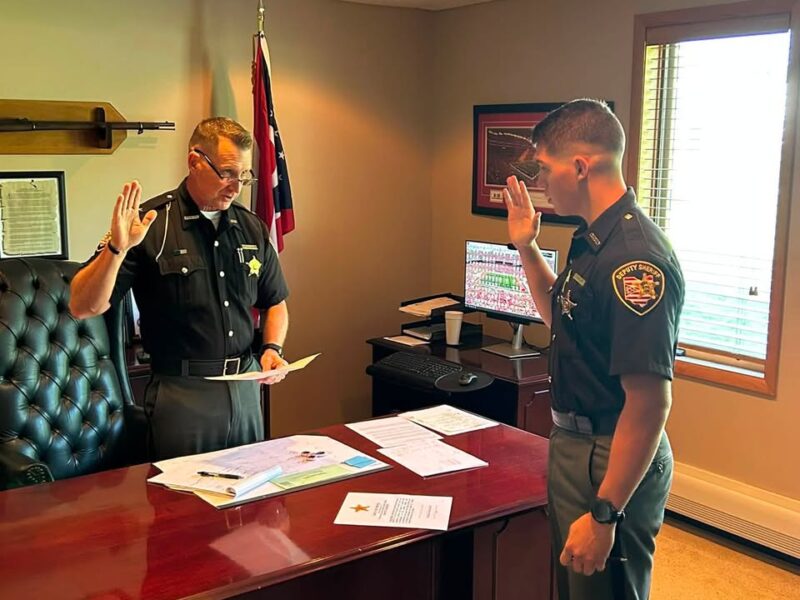 Sheriff Christopher Stratton swears in Deputy Adam Miller