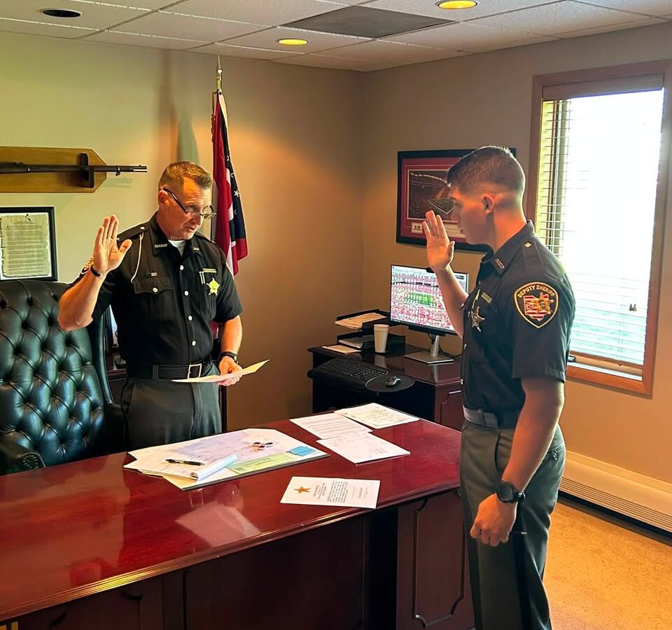 Sheriff Christopher Stratton swears in Deputy Adam Miller