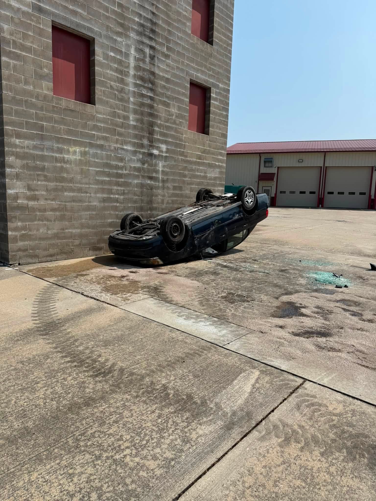 An overturned car sits at the Washington Township Fire & Rescue training tower