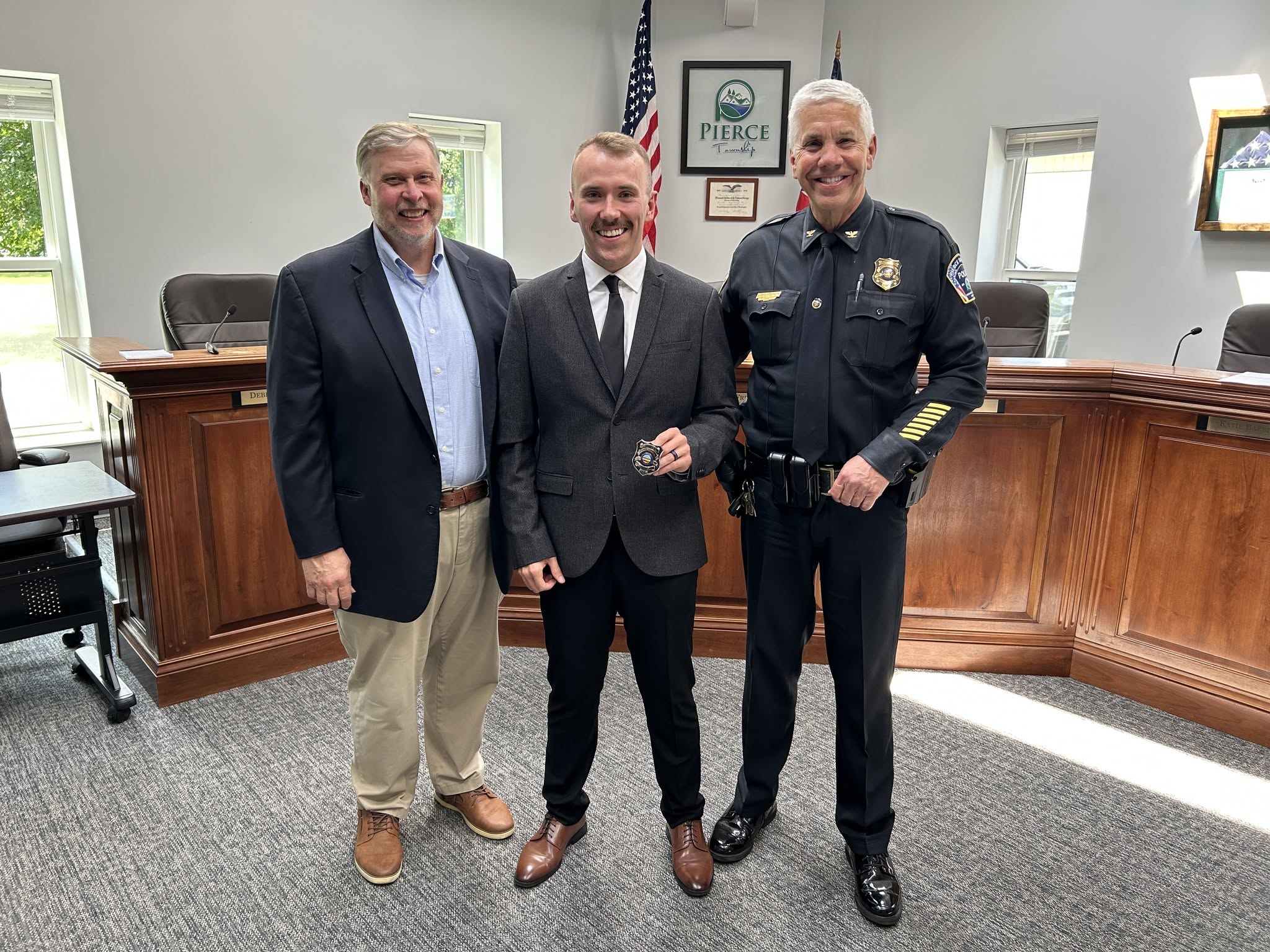 Officer Dakota Gullett stands with Police Chief Paul Broxterman following his swearing-in