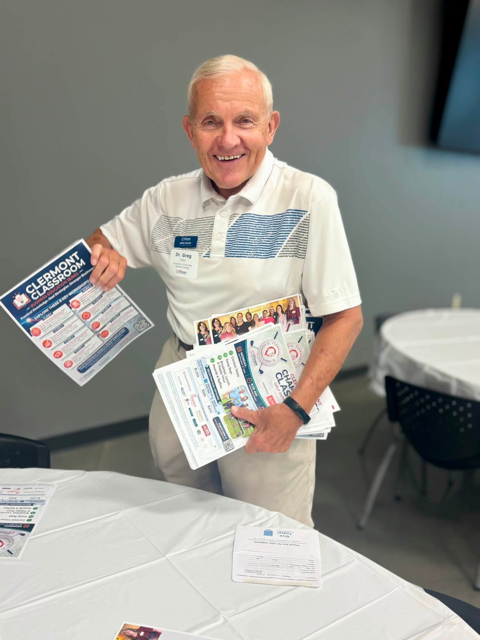 Attendee shares Clermont Chamber program materials at LEAD Clermont luncheon