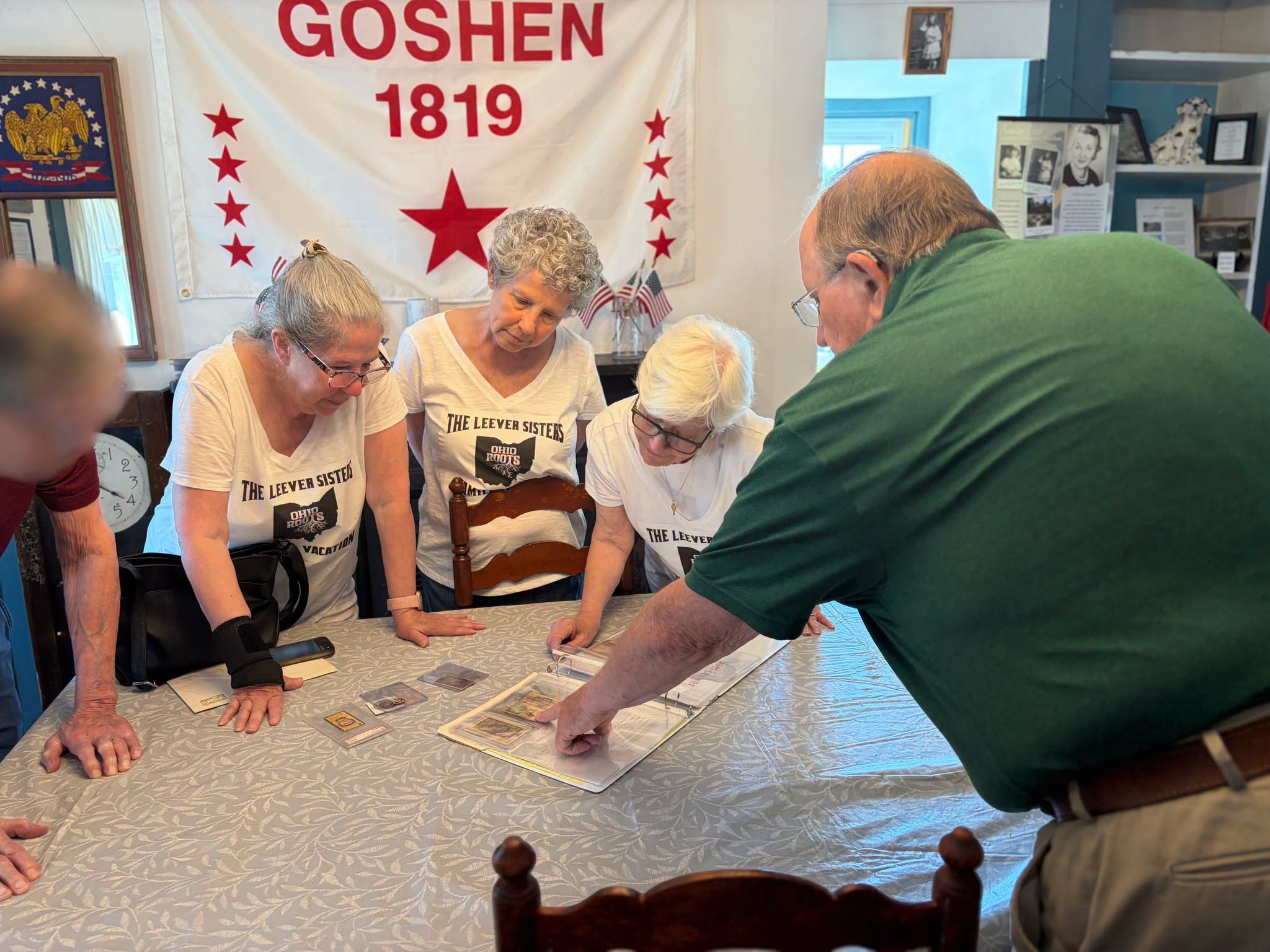 Leever Sisters examine Sam Leever memorabilia at Goshen museum