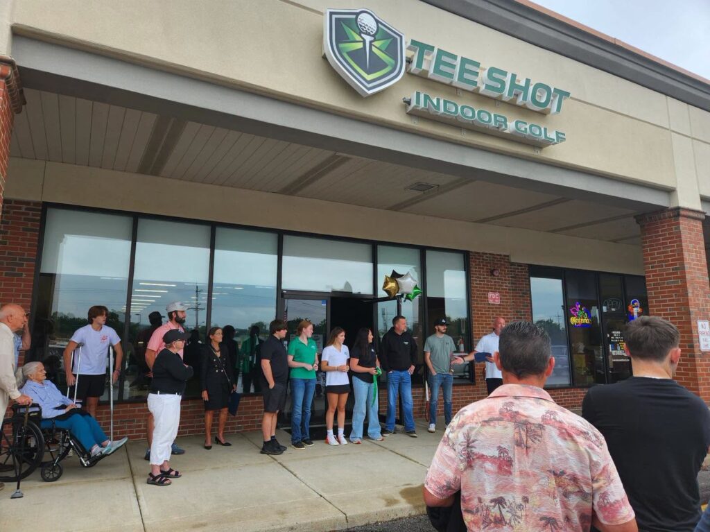 Crowd gathers for Tee Shot Indoor Golf grand opening in Milford
