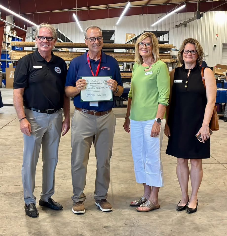 Batavia Township officials present a certificate of congratulations to Air Handling Equipment