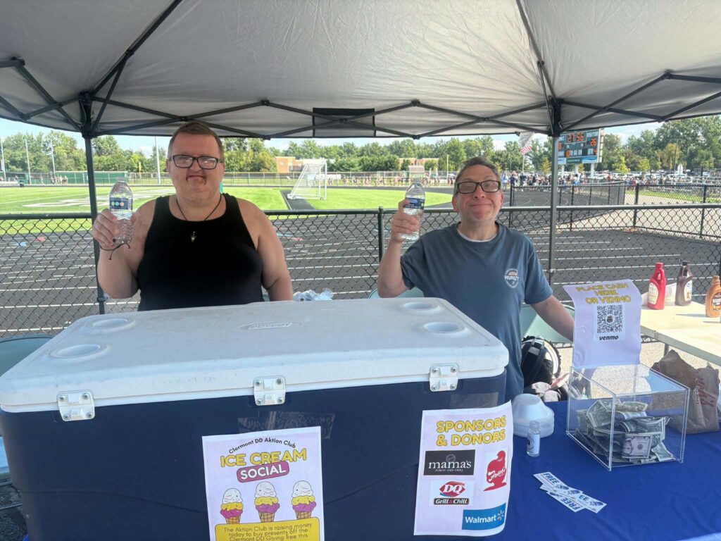 Aktion Club members staff the ice cream social booth