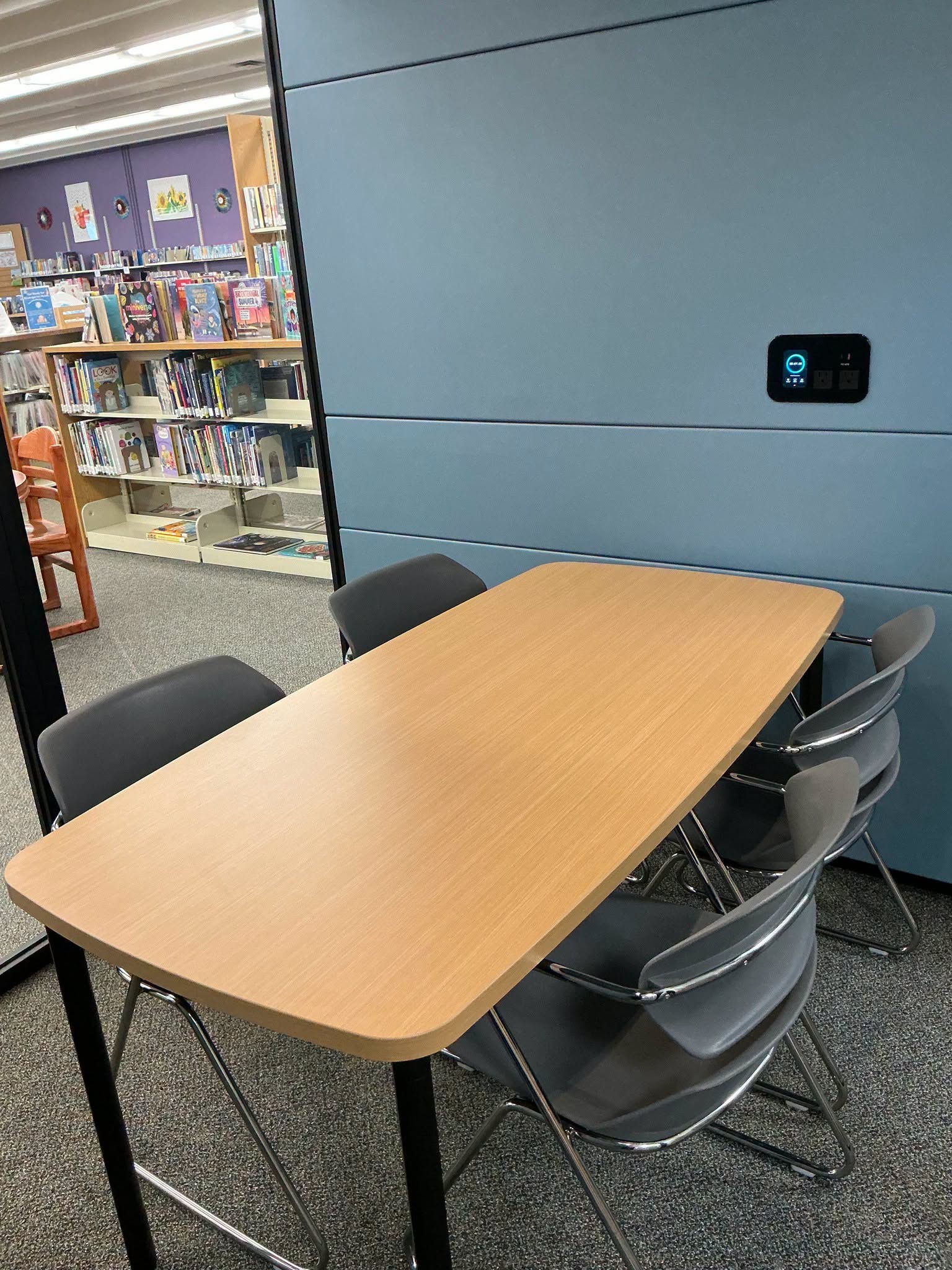 Seating and power outlets inside the new Batavia Branch study pod