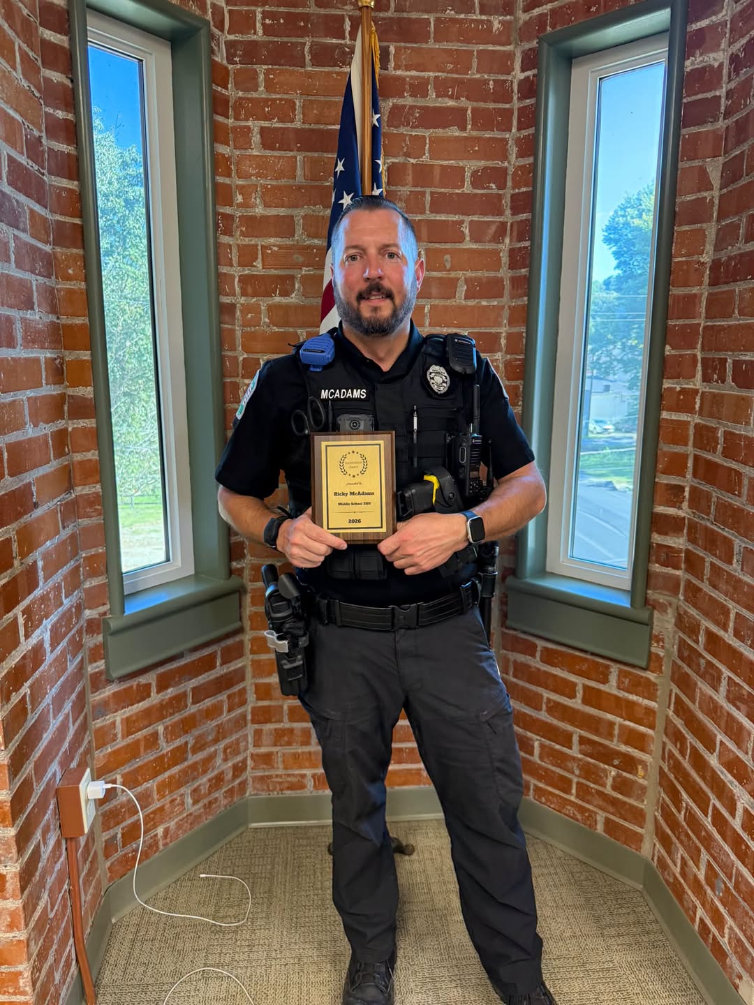 Batavia Officer Ricky McAdams holds his Appreciation Award