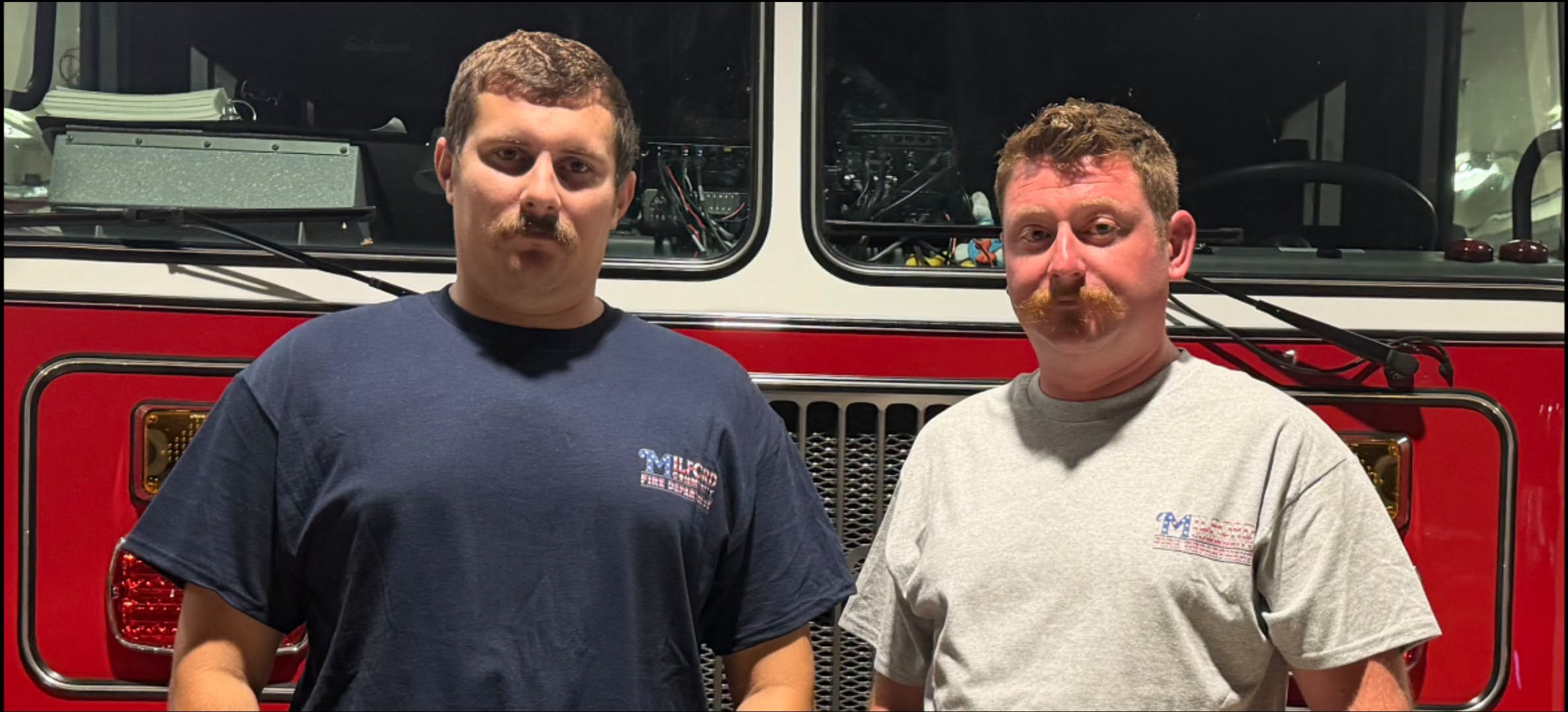 Milford firefighters Lt. Baird and Firefighter Rose wear 9/11 tribute shirts