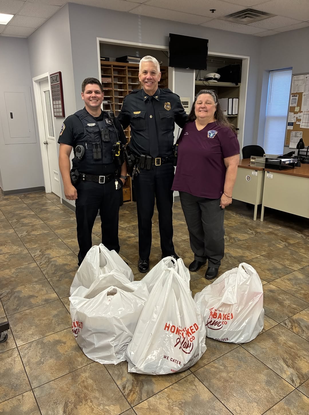 Pierce Township police and fire staff pose with Honey Baked Ham donation