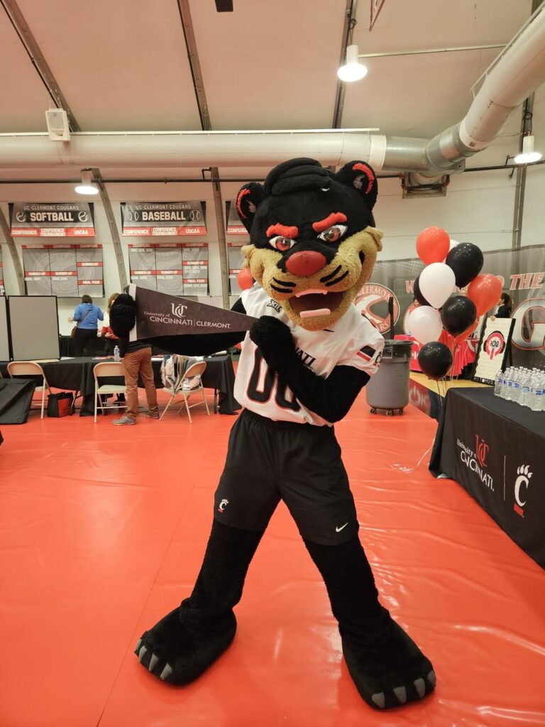 UC Clermont mascot greets students at a campus recruiting event