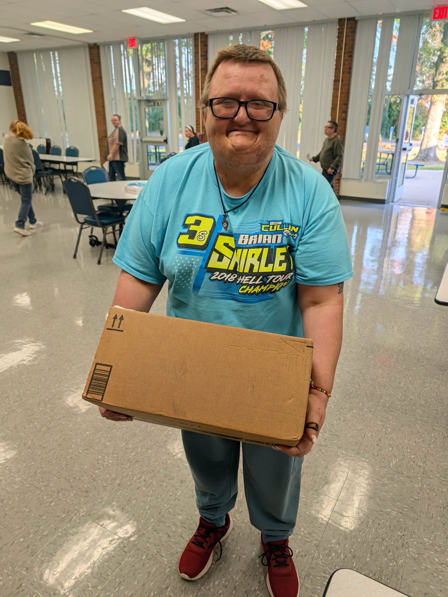 An Aktion Club of Clermont County member packs donated socks
