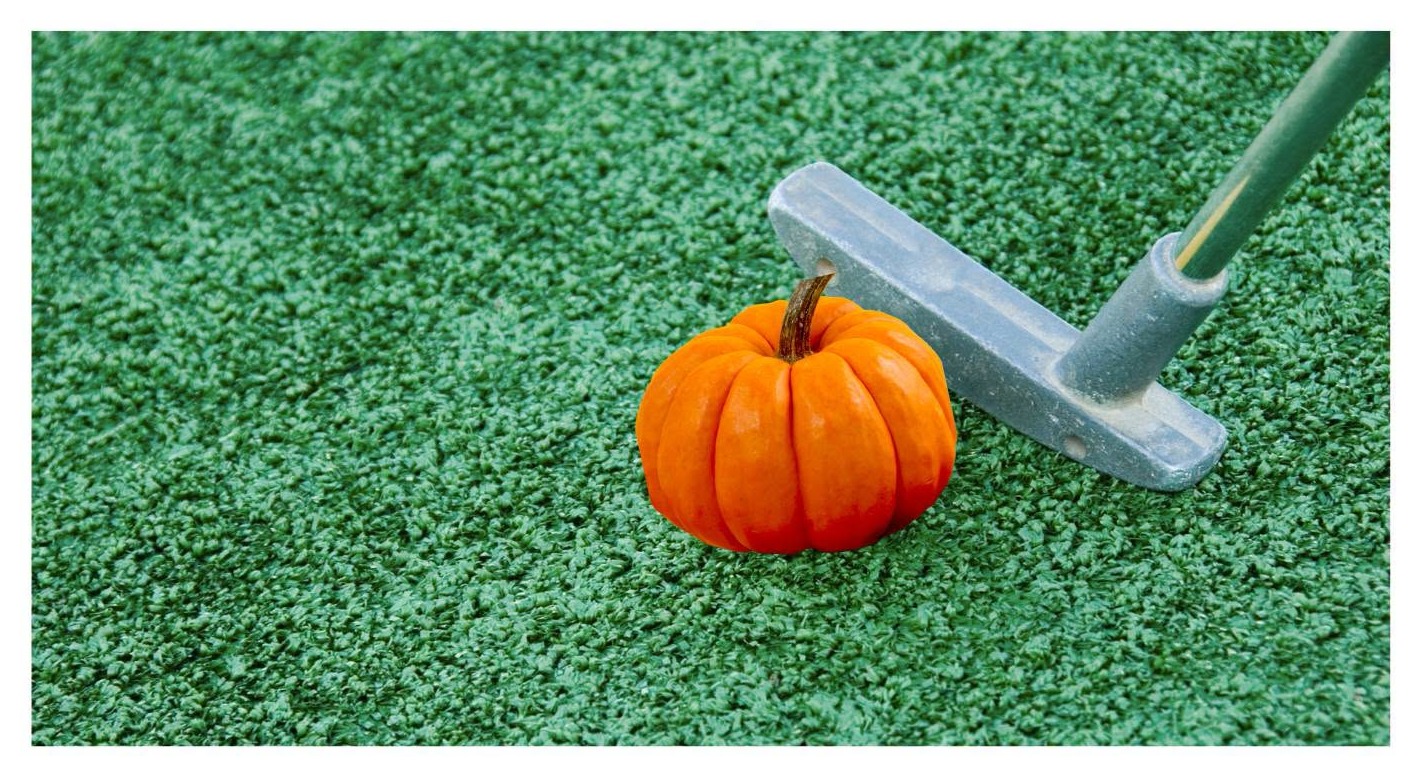 A golf club rests next to a mini pumpkin ahead of the Goshen library Pumpkin Putt-Putt event