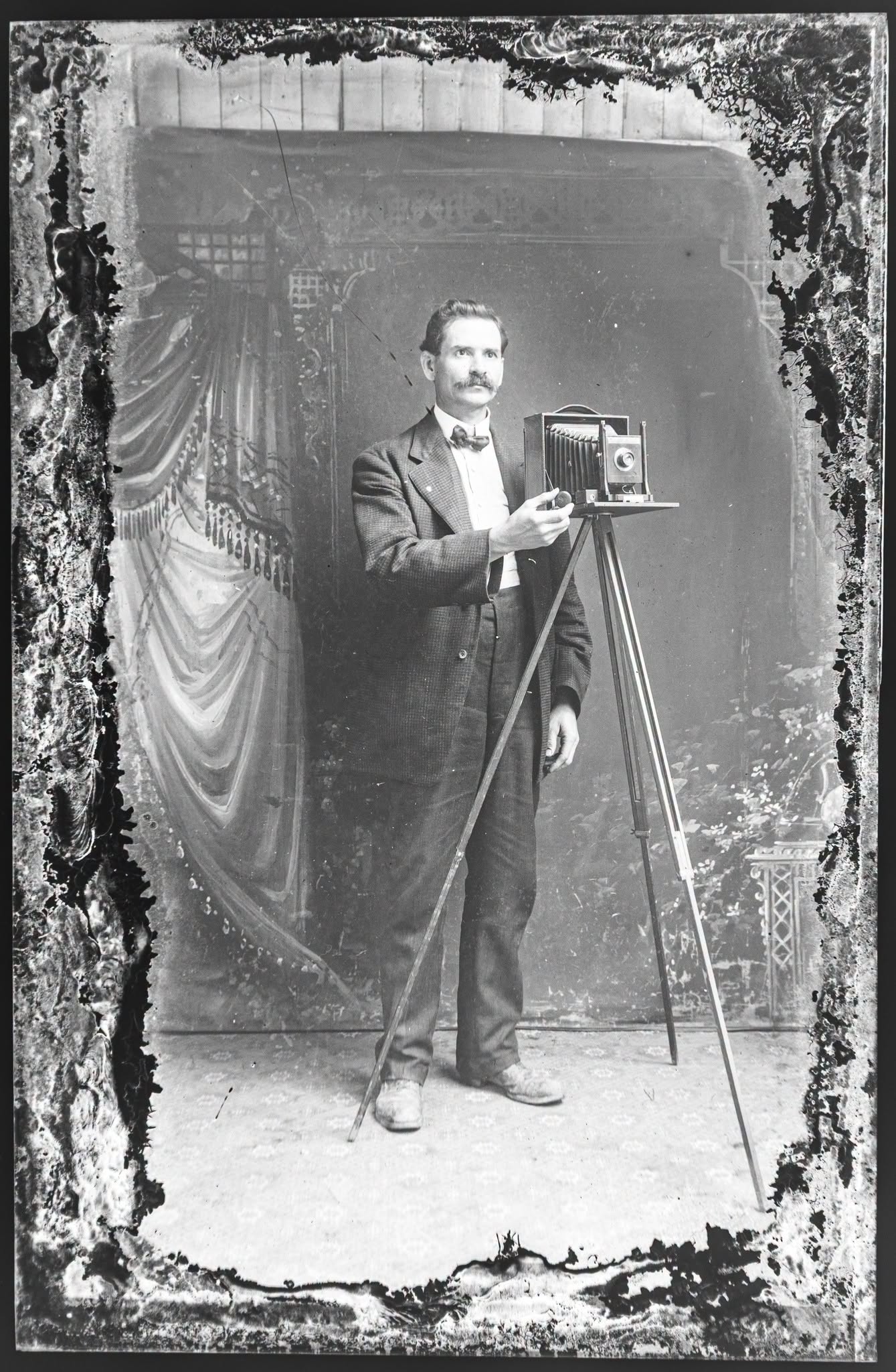 Restored glass-plate portrait of the unidentified photographer