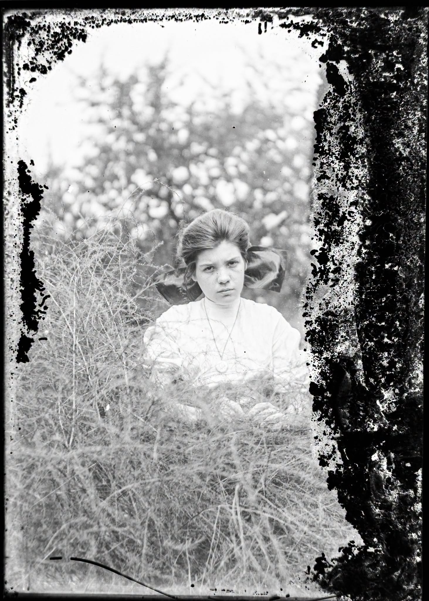 Restored glass-plate portrait of an unidentified young woman