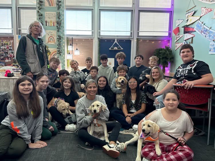Goshen Middle School career tech class with Circle Tail puppies