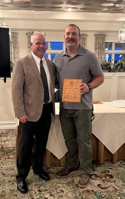 Chief Edward Myers presents an award at the Goshen Fire/EMS banquet