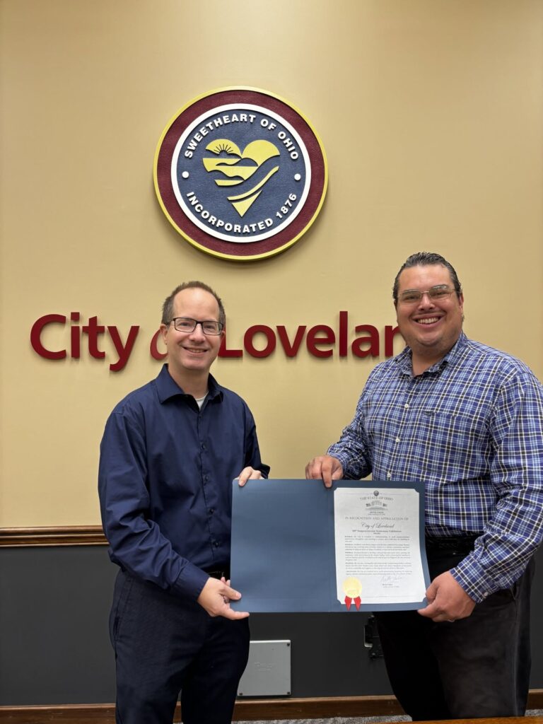 Loveland officials display sesquicentennial recognition certificate