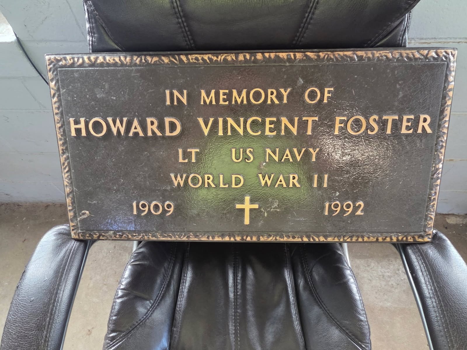 A bronze memorial marker reading In Memory of Howard Vincent Foster, Lt. US Navy, World War II, 1909-1992
