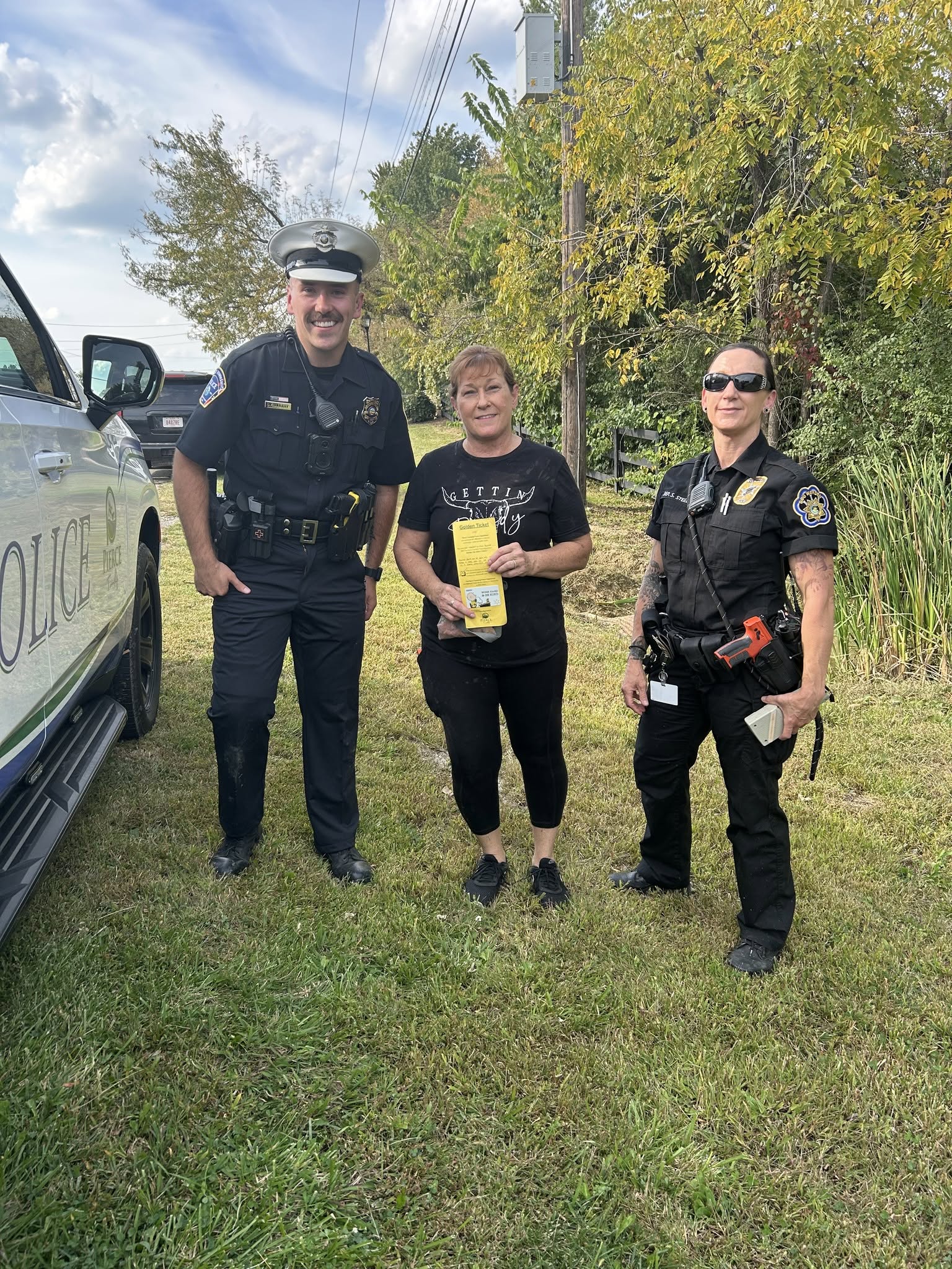 Pierce Township police present a Golden Ticket after a dog rescue