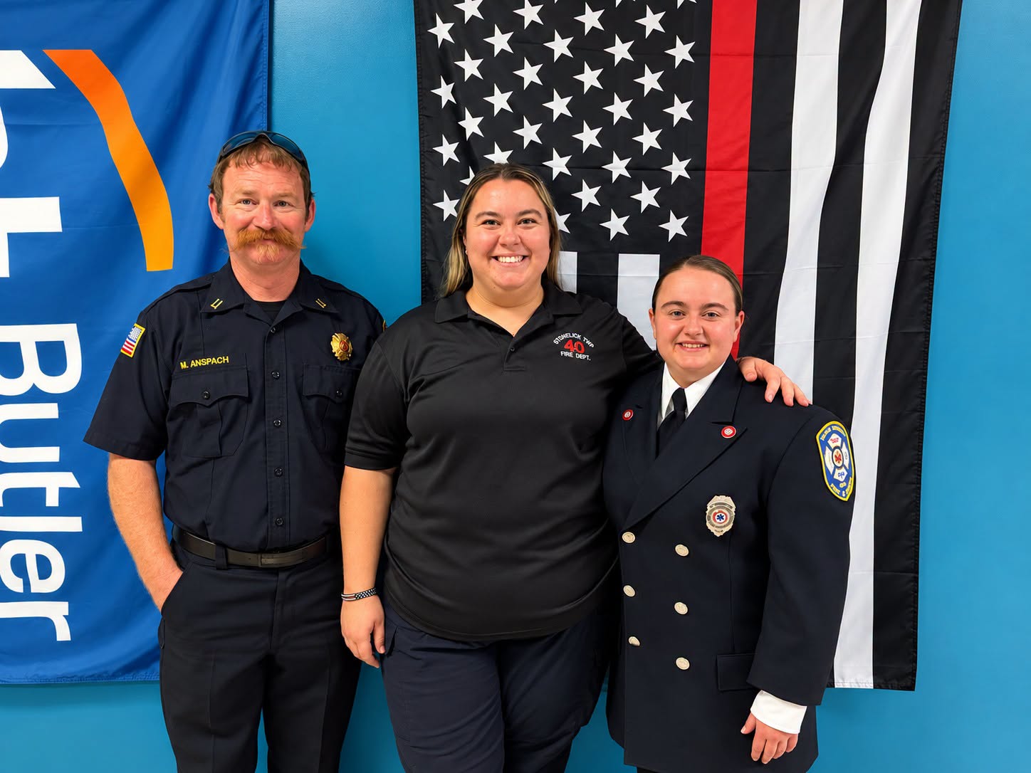 Stonelick Township Fire Department leaders congratulate a paramedic graduate