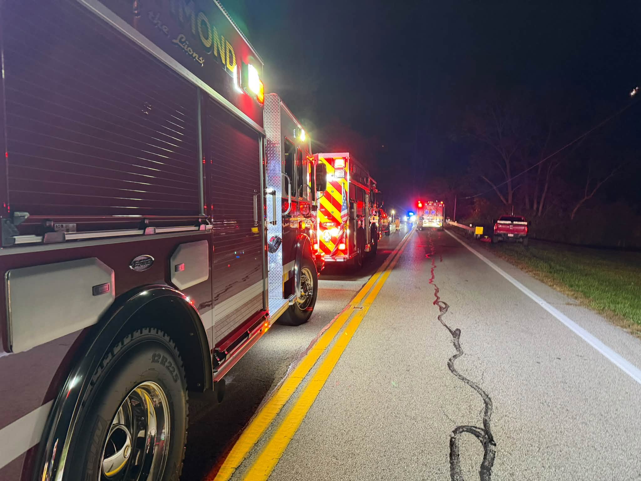 Fire apparatus line U.S. Route 52 at rollover crash scene